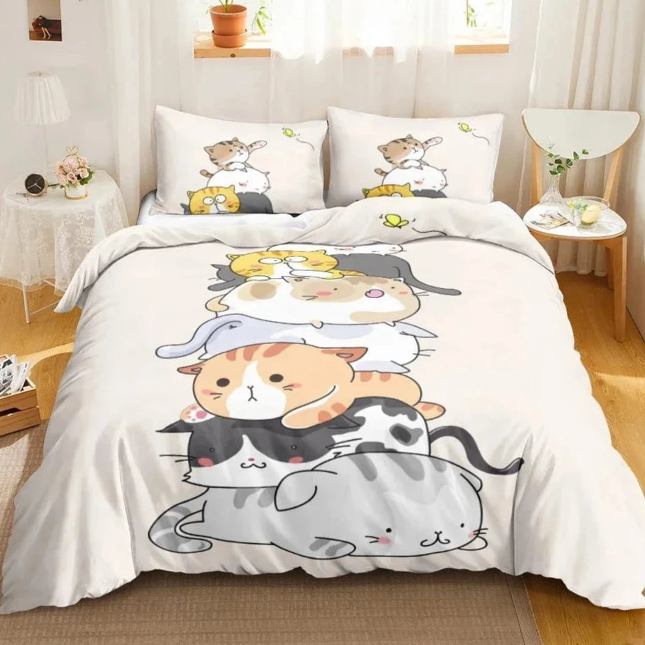 bedding set showcases an adorable and playful design featuring a stack of various cartoon cats, each with distinct patterns and expressions, piled on top of one another in a fun and whimsical composition. The soft cream background complements the colorful, cheerful illustrations, making it an ideal choice for a child's bedroom or for anyone who adores cute, feline-themed decor.