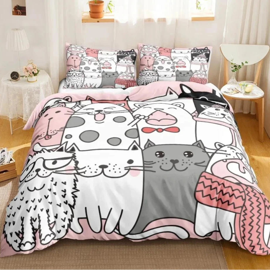 bedding set features a playful and charming array of large cartoon cat faces, each with unique patterns and cheerful expressions, set against a soft pink and gray color palette. The whimsical design includes cats adorned with accessories such as bows and scarves, adding a touch of whimsy and style.